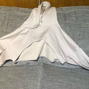 Popflex shruggie or hooded shrug it’s a tan/beige color size L/XL. Never worn
